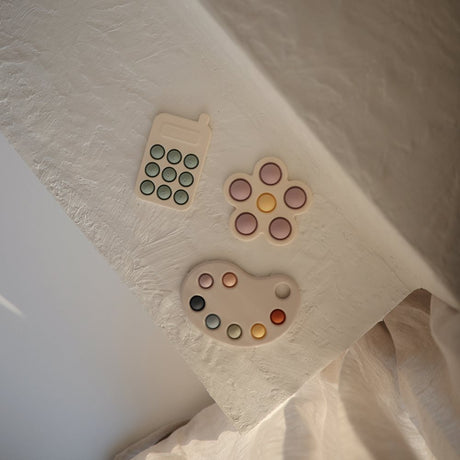 Mushie pop it mänguasi Telefon Tradewinds