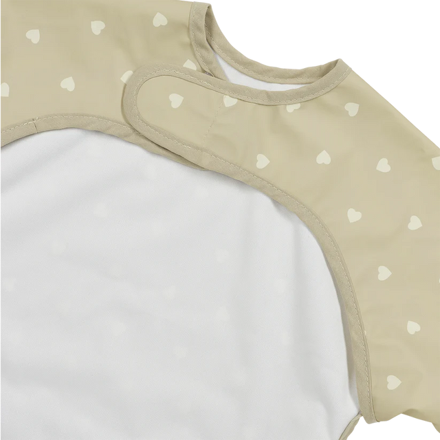 Meyco Baby neperšlampamas seilinukas su rankovėmis 6–24 mėn., Sweet Heart Sand/Soft Sand