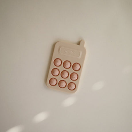 Mushie pop it mänguasi Telefon Tradewinds 